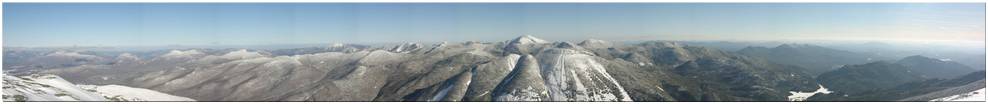 Looking southeast at Pitchoff Mtn, Cascade Mtn, Porter Mtn, Big Slide Mtn, Hurricane Mtn, Mt. Phelps, Giant Mtn, Rocky Peak, Lower Wolfjaw Mtn, Upper Wolfjaw Mtn, Tabletop Mtn, Indian Falls, Armstrong Mtn, Gothics Mtn, Saddleback Mtn, Basin Mtn, Mt. Dix, Nippletop Mtn, Mt. Marcy, Gray Peak, Mt. Colden, Mt. Skylight, Mt. Redfield, Allen Mtn, Cliff Mtn, Cheney Cobble, Rist Mtn, Calamity Mtn, Mt. Adams, Yard Mtn, Hough Peak