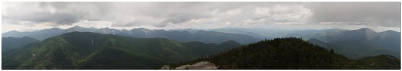 Looking northwest at Allen Mtn, Blake Mtn, Santanoni Peak, Mt. Skylight, Mt. Marcy, Nippletop Mtn, Mt. Haystack, Little Haystack, Algonquin Peak, Basin Mtn, Sawteeth Mtn, Armstrong Mtn, Tabletop Mtn, Pyramid Peak, Gothics Mtn, Armstrong Mtn, Yard Mtn, Big Slide Mtn, Upper Wolfjaw Mtn, Lower Wolfjaw Mtn, Dial Mtn, Noonmark Mtn, Round Mtn, Giant Mtn, Rocky Peak, Whiteface Mtn, Esther Mtn, Cascade Mtn, Porter Mtn, Blueberry Mtn, Saddleback Mtn