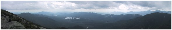 Looking southwest at Macomb Mtn, Nippletop Mtn, Blake Mtn, Allen Mtn, Mt. Skylight, Mt. Marcy, Mt. Haystack, Santanoni Peak, Cheney Cobble, Rist Mtn, Basin Mtn, Algonquin Peak