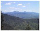 Looking east at Mt. Marshall, Mt. Marcy, Mt. Colden, Iroquois Mtn, Algonquin Peak, Wright Peak, Big Slide Mtn, Giant Mtn, Mt. Skylight, Mt. Redfield, MacNaughton Mtn, Duck Hole
