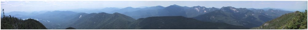 Looking west at Blake Mtn, Allen Mtn, Mt. Redfield, Mt. Skylight, Mt. Haystack, Mt. Marcy, Mt. Colvin, Algonquin Peak, Wright Peak, Basin Mtn, Tabletop Mtn, Saddleback Mtn, Sawteeth Mtn, Gothics Mtn, Armstrong Mtn, Big Slide Mtn, Upper Wolfjaw Mtn, Cascade Mtn, Whiteface Mtn, Lower Wolfjaw Mtn, Pyramid Peak, Porter Mtn, Blueberry Mtn, Esther Mtn, Little Haystack, Mt. Redfield, Cheney Cobble, Rist Mtn