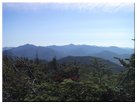 Looking east at Cascade Mtn, Wallface Mtn, Algonquin Peak, Iroquois Mtn, Mt. Marshall, Tabletop Mtn, Mt. Colden, Mt. Marcy, Mt. Haystack, Mt. Skylight, Mt. Redfield, Mt. Dix, Hough Peak, Henderson Mtn, Calamity Mtn, Allen Mtn, Macomb Mtn
