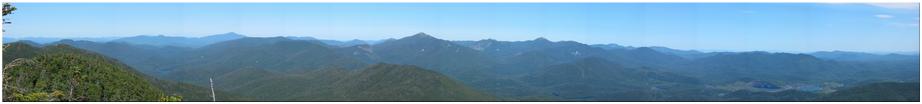 Looking northeast at Whiteface Mtn, Algonquin Peak, Iroquois Mtn, Mt. Marshall, Mt. Colden, Mt. Marcy, Allen Mtn, Macomb Mtn, Mt. Dix, Nippletop Mtn, Calamity Mtn, Mt. Adams, Wallface Mtn, Cascade Mtn, Pitchoff Mtn, MacNaughton Mtn, Street Mtn, Panther Peak, Henderson Mtn, Giant Mtn, Mt. Phelps, Gray Peak, Cliff Mtn, Mt. Haystack, Little Haystack, Mt. Skylight, Mt. Redfield, Hough Peak, Cheney Cobble, Rist Mtn