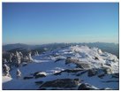 Looking south at Giant Mtn, Round Mtn, Noonmark Mtn, East Dix Mtn, Mt. Dix, Macomb Mtn, Nippletop Mtn, Cascade Mtn, Upper Wolfjaw Mtn, Armstrong Mtn, Gothics Mtn, Saddleback Mtn, Basin Mtn, Mt. Haystack, Tabletop Mtn, Mt. Marcy, Gray Peak, Mt. Redfield, Mt. Colden, Porter Mtn, Pitchoff Mtn